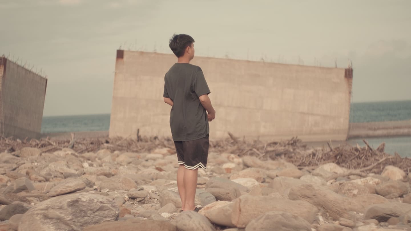 boy looking at pacific ocean in Taitung Taiwan
