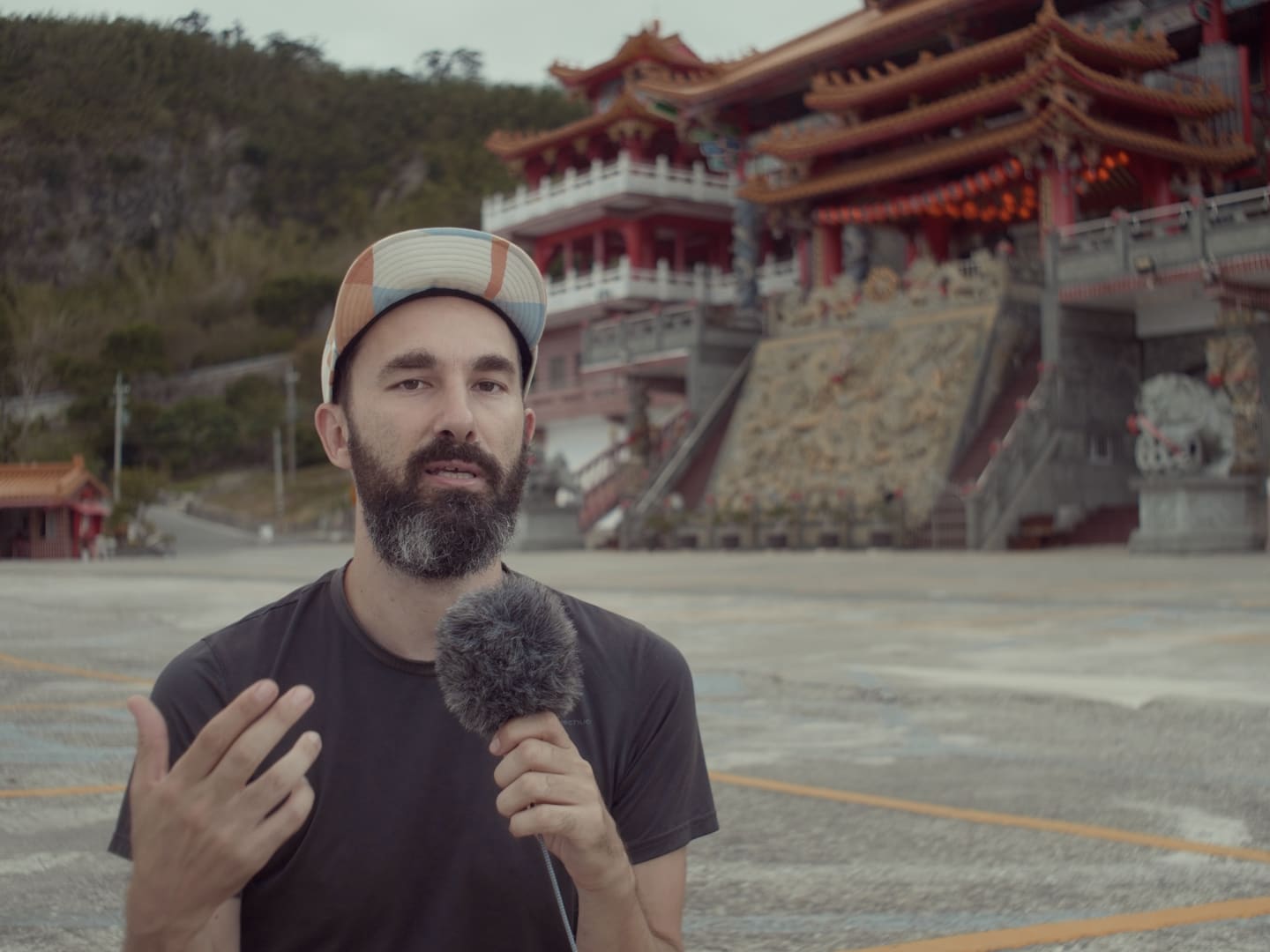 podcast in front of dao temple in Taiwan