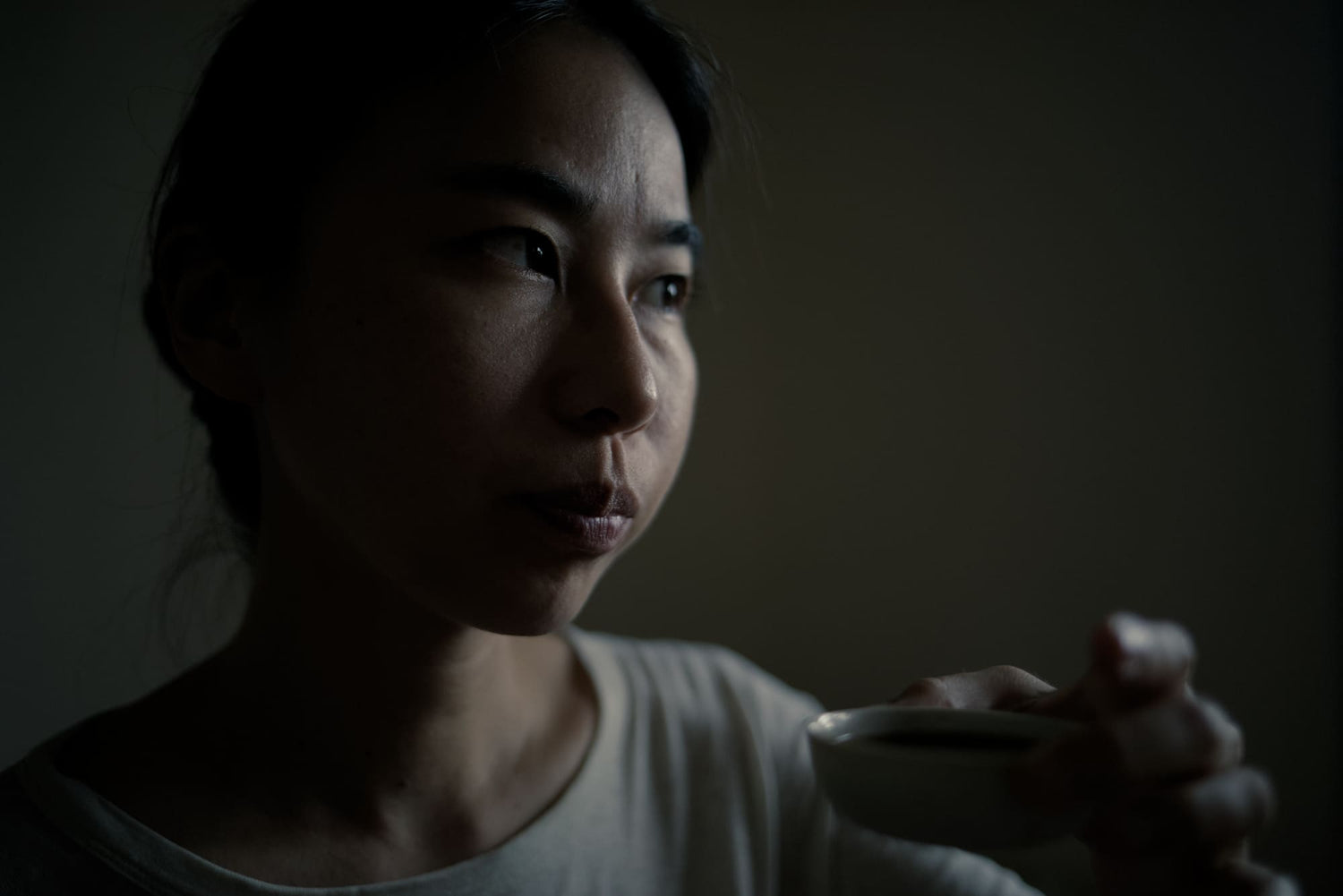 tea master holding porcelain cup