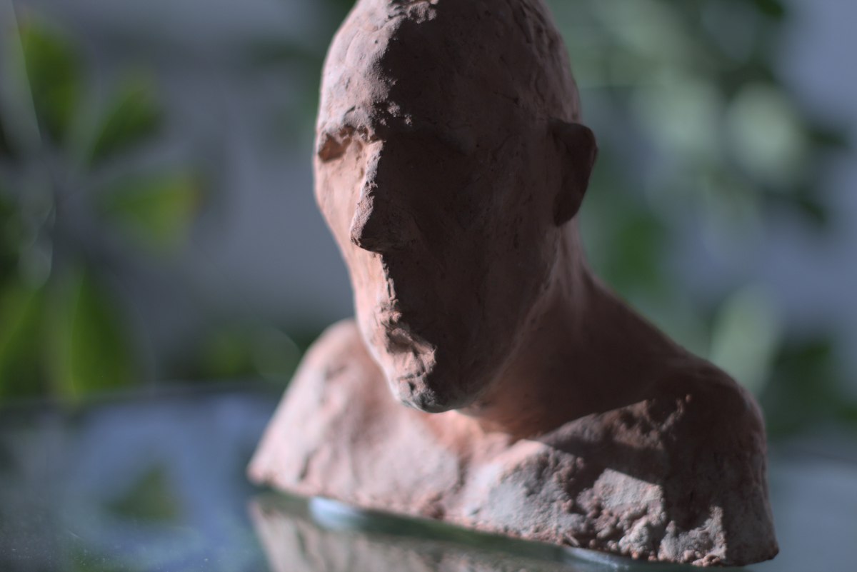 an clay Sculpture of man in tea room in Berlin