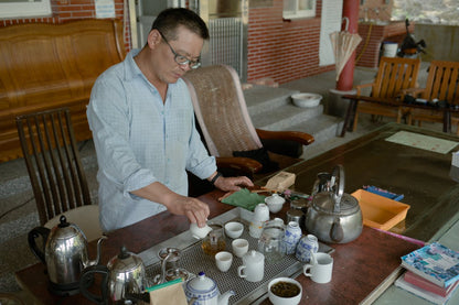 farmer brewing naturally farmed tea