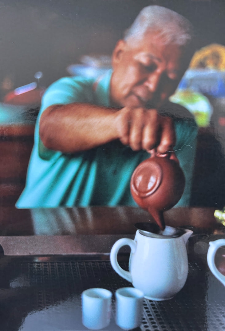 Taiwanese tea master pouring with Zisha tea pot 