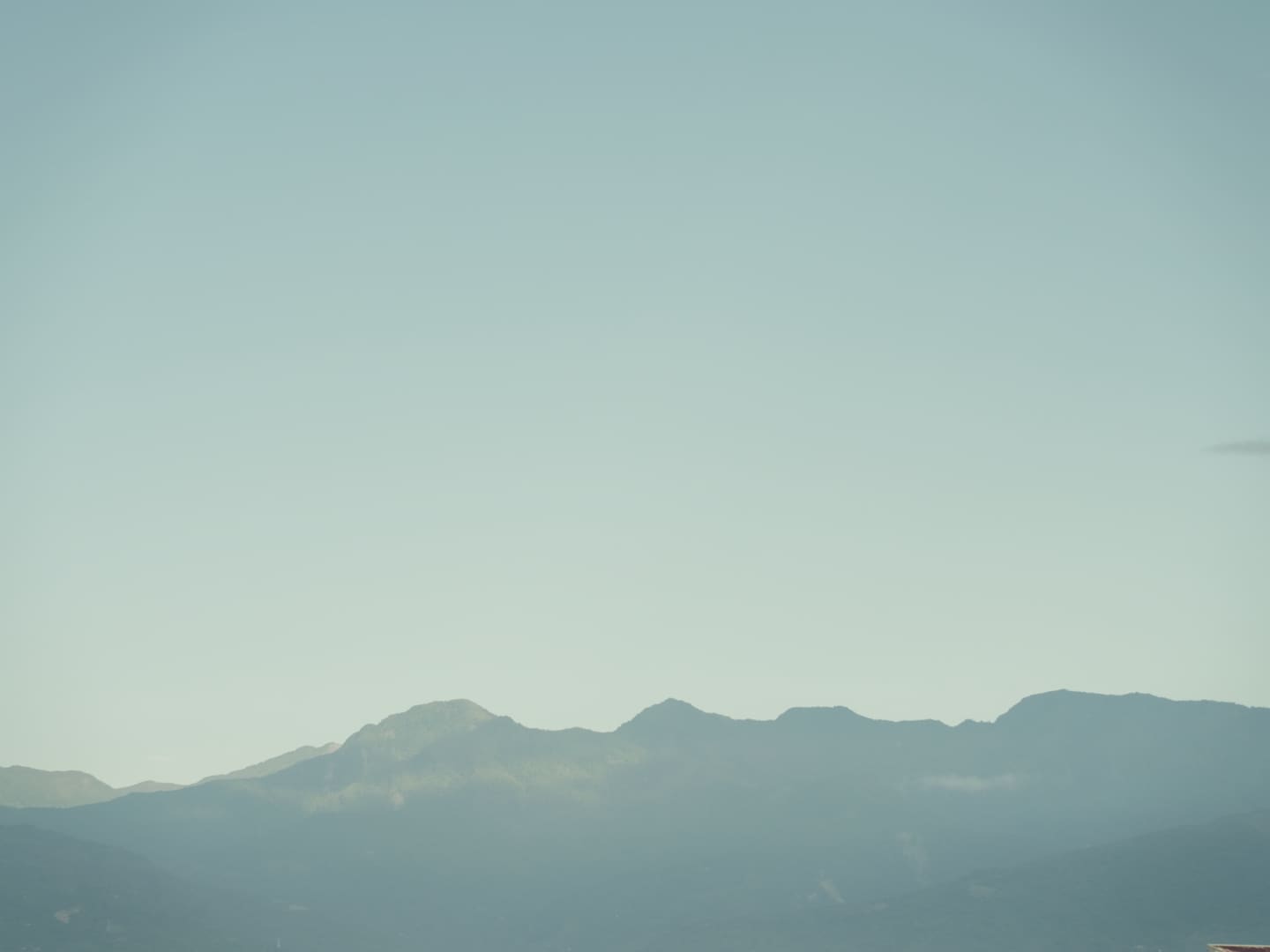 mountain range under blue sky in Taiwan