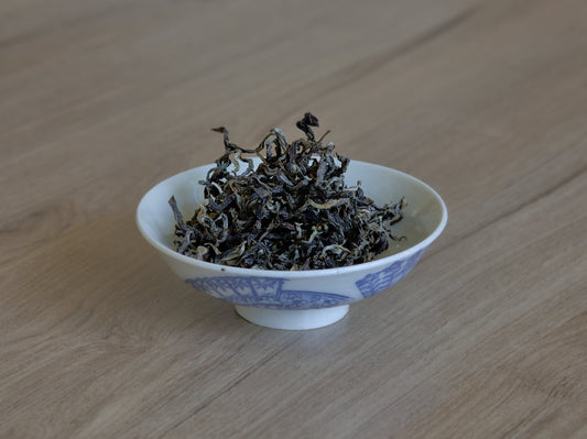 naturally farmed dry yellow tea leaves in gaiwan
