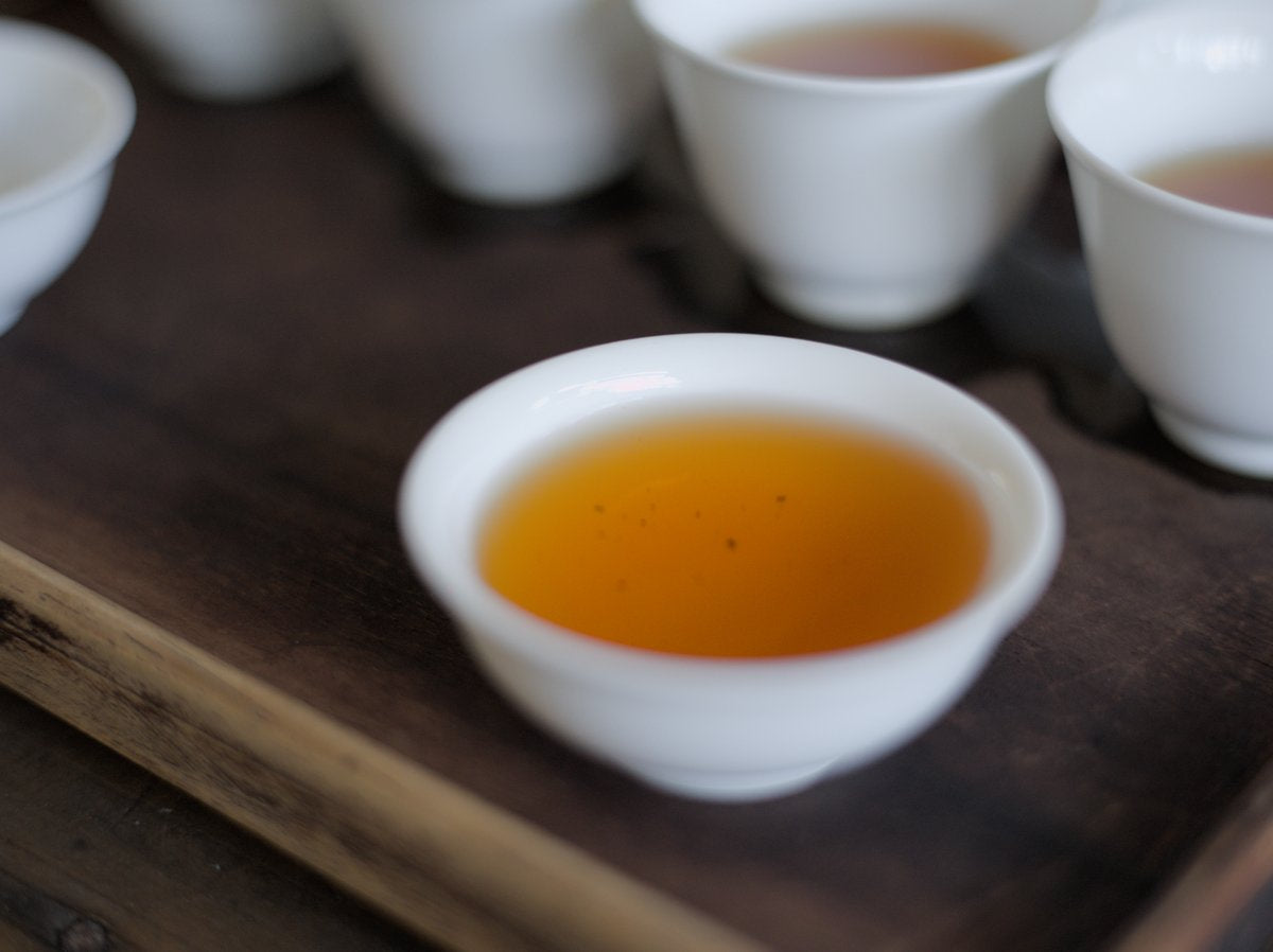 naturally farmed Ruby Red Jade black tea in a white porcelain cup