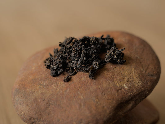 naturally farmed Ruby Red Jade oolong tea sitting on a rock