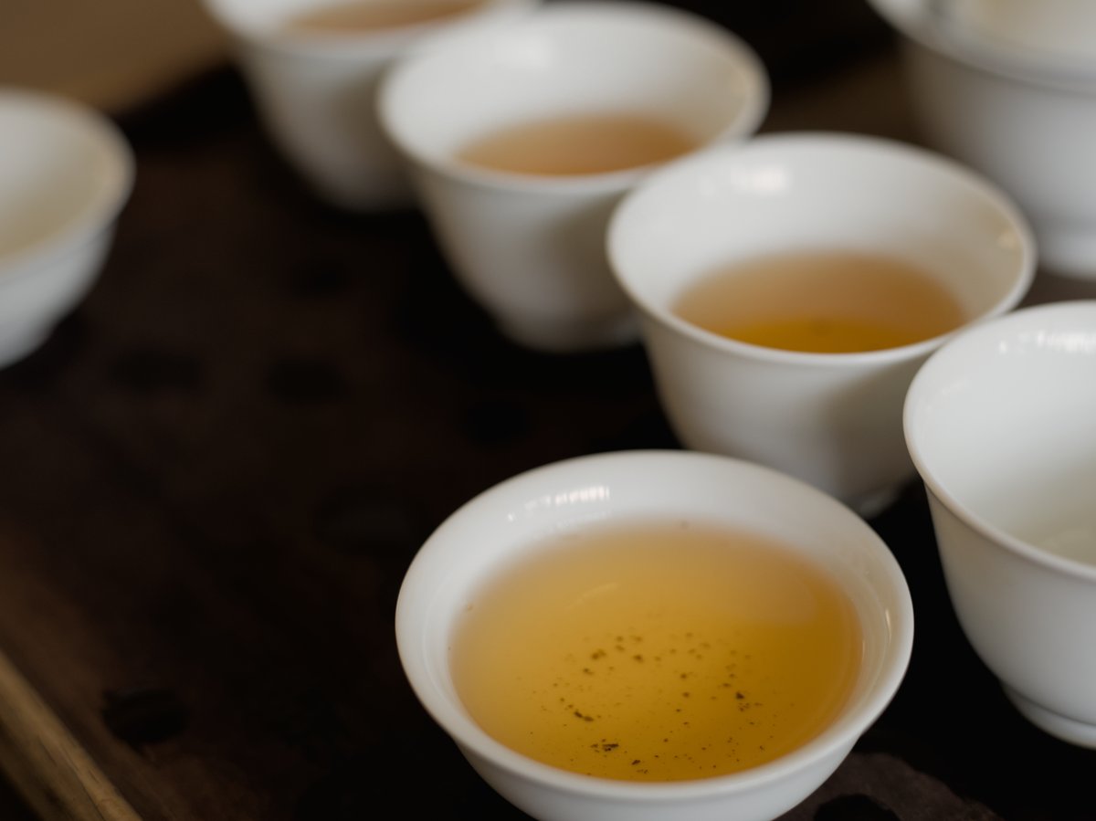 white porcelain cups filled with naturally farmed Ruby Red Jade oolong tea